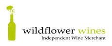 Wine bottle with wild flower coming out of it, with text saying Wildflower Wines, Independent Wine Merchants